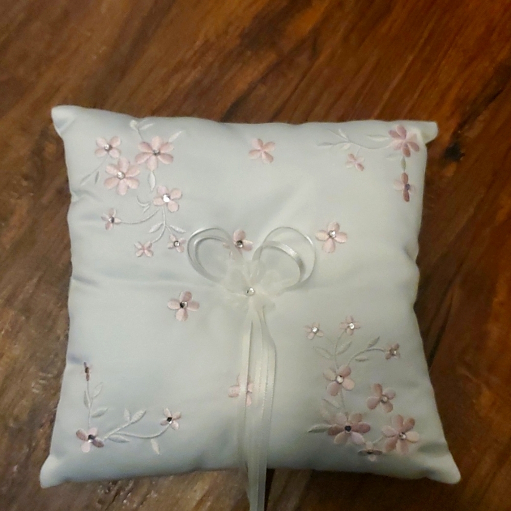 White ring bearer pillow with light pink embroidered flowers, ribbon & rhineston